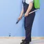 Bed bug exterminator applying indoor treatment along baseboards in {city}, {state}